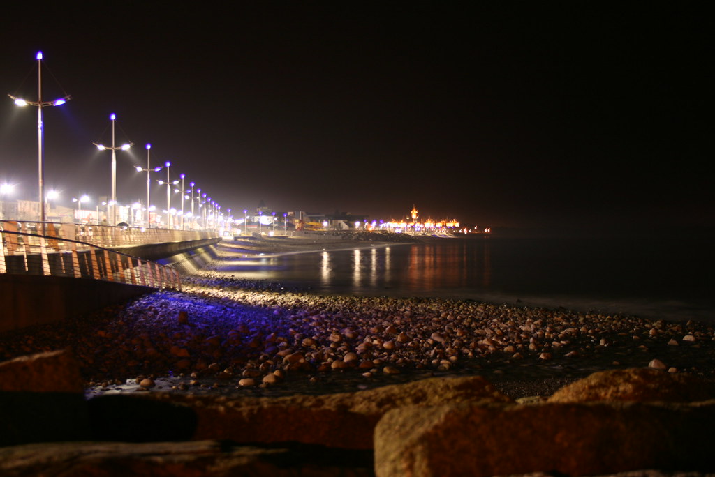 Sunset walk on seaside promenade